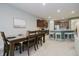 Dining room features a dark wood table, seating for six, and views of the kitchen at 18630 Goldwater Rd, Westfield, IN 46062