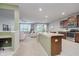 Open kitchen featuring a center island with seating, stainless appliances, and wood cabinets at 18630 Goldwater Rd, Westfield, IN 46062