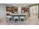 Well-appointed kitchen featuring an island with seating, stainless appliances, and ample cabinet space at 18630 Goldwater Rd, Westfield, IN 46062