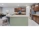 Spacious kitchen featuring an island with seating, stainless appliances, and granite countertops at 18630 Goldwater Rd, Westfield, IN 46062