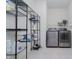Functional laundry room featuring shelving, a modern washer and dryer, and tiled flooring at 18630 Goldwater Rd, Westfield, IN 46062