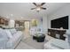 Spacious living room with a large TV, open to the kitchen, perfect for entertaining at 18630 Goldwater Rd, Westfield, IN 46062