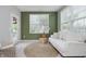 Bright sunroom with white sofa, jute rug, and access to the outdoors at 18630 Goldwater Rd, Westfield, IN 46062