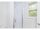 This bathroom has an enclosed glass shower and a window that offers natural light to the space at 19446 Ethan Allen Ln, Westfield, IN 46074