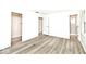 This bedroom features neutral walls and flooring with multiple points of entry making it a spacious atmosphere at 19446 Ethan Allen Ln, Westfield, IN 46074