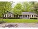 Beautiful home surrounded by trees and greenery, featuring a well-maintained front yard and landscaping at 19446 Ethan Allen Ln, Westfield, IN 46074