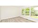 Spacious living room with a large window, light-toned floors, and neutral wall color, offering a bright and airy atmosphere at 19446 Ethan Allen Ln, Westfield, IN 46074