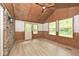 Cozy sunroom with natural wood paneled ceiling and brick accents at 19446 Ethan Allen Ln, Westfield, IN 46074