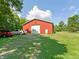 Exterior view of the barn, featuring ample parking and freshly mowed lawn at 19702 Centennial Rd, Sheridan, IN 46069