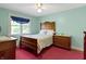 Comfortable bedroom features ceiling fan, natural light and period furniture at 19702 Centennial Rd, Sheridan, IN 46069