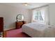 Bright bedroom with vintage vanity and large window, offering a cozy and classic appeal at 19702 Centennial Rd, Sheridan, IN 46069