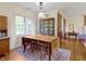 Spacious dining room featuring hardwood floors, a charming hutch, and a large table with vintage decor at 19702 Centennial Rd, Sheridan, IN 46069