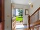 Charming foyer showcasing hardwood floors, staircase, and a picturesque view through the open doorway at 19702 Centennial Rd, Sheridan, IN 46069