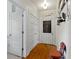 Bright hallway with hardwood floors and decorative doors at 19702 Centennial Rd, Sheridan, IN 46069