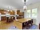 Bright kitchen with a center island, hardwood floors, ample cabinetry, and natural light at 19702 Centennial Rd, Sheridan, IN 46069