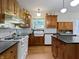 Traditional kitchen with wood cabinets, a vintage stove, and a farmhouse sink at 19702 Centennial Rd, Sheridan, IN 46069