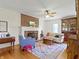 Bright living room showcasing hardwood floors, brick fireplace, and classic furniture arrangement at 19702 Centennial Rd, Sheridan, IN 46069
