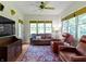 Comfortable living room featuring large windows, hardwood floors, and cozy seating arrangements at 19702 Centennial Rd, Sheridan, IN 46069