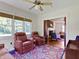 Cozy sitting room featuring recliner chairs, large windows, and a view into the adjacent living area at 19702 Centennial Rd, Sheridan, IN 46069