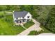 Aerial view of a well-landscaped home with a long driveway and mature trees at 20400 Chatham Hills Blvd, Westfield, IN 46074