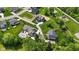 Aerial view of a neighborhood showcasing well-maintained lawns, beautiful homes, and lush trees at 20400 Chatham Hills Blvd, Westfield, IN 46074