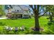 Expansive backyard with lush green lawn, mature trees, and inviting outdoor seating area at 20400 Chatham Hills Blvd, Westfield, IN 46074