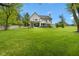Well-manicured backyard featuring a spacious lawn and a charming patio area for relaxation at 20400 Chatham Hills Blvd, Westfield, IN 46074