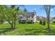 Spacious backyard featuring a black fence and a partial view of the house at 20400 Chatham Hills Blvd, Westfield, IN 46074