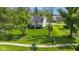 Aerial view of a large, green backyard with mature trees surrounding a stylish home at 20400 Chatham Hills Blvd, Westfield, IN 46074