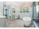 Bright primary bathroom features a soaking tub and spacious shower at 20400 Chatham Hills Blvd, Westfield, IN 46074