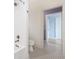 White bathroom features white subway tiles, a toilet, and gray and white hexagon floor tiles at 20400 Chatham Hills Blvd, Westfield, IN 46074
