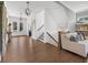 Inviting foyer with hardwood flooring, staircase, and access to a cozy living area at 20400 Chatham Hills Blvd, Westfield, IN 46074