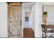 Bright hallway with hardwood floors, sliding barn door, and access to other rooms at 20400 Chatham Hills Blvd, Westfield, IN 46074