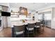 Island kitchen boasts quartz countertops, wooden accents, and open shelving at 20400 Chatham Hills Blvd, Westfield, IN 46074
