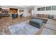 Spacious living room features a comfortable sofa, stylish rug, and custom shelving and bar, perfect for relaxing at 20400 Chatham Hills Blvd, Westfield, IN 46074