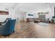 Open-concept living room with stylish decor, wood-look flooring, and ample seating for entertaining guests at 20400 Chatham Hills Blvd, Westfield, IN 46074