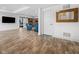 Spacious living area with wood-look flooring leading to a cozy seating area and entertainment space at 20400 Chatham Hills Blvd, Westfield, IN 46074