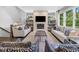 Spacious living room featuring a fireplace, built-in shelves, and comfortable seating at 20400 Chatham Hills Blvd, Westfield, IN 46074