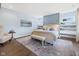 Serene main bedroom featuring a sitting area, accent wall, and decorative shelves at 20400 Chatham Hills Blvd, Westfield, IN 46074