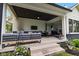 Inviting covered patio featuring outdoor seating, a grill, and seamless indoor-outdoor living at 20400 Chatham Hills Blvd, Westfield, IN 46074