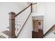 Bright staircase with stained wood and white risers leads to the upper level at 20400 Chatham Hills Blvd, Westfield, IN 46074