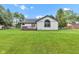This backyard has a large lawn, privacy fence and deck; perfect for entertaining and outdoor activities at 206 Cranberry Dr, Greenfield, IN 46140