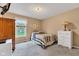This cozy bedroom features carpet, dresser, and natural light from the window at 206 Cranberry Dr, Greenfield, IN 46140