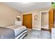 Neutral bedroom offers comfort with soft carpet, a dresser, and a spacious closet at 206 Cranberry Dr, Greenfield, IN 46140