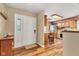 Open foyer with hardwood floors and views into the kitchen with stainless steel appliances at 206 Cranberry Dr, Greenfield, IN 46140