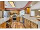 Functional kitchen featuring stainless steel appliances, ample cabinets, and hardwood flooring at 206 Cranberry Dr, Greenfield, IN 46140