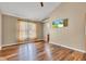 This cozy living room features beautiful hardwood floors, neutral walls, natural light and an entertainment center at 206 Cranberry Dr, Greenfield, IN 46140