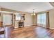 Bright living room with hardwood floors and natural light, open to the kitchen at 206 Cranberry Dr, Greenfield, IN 46140