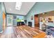 Inviting living room boasts natural light with vaulted ceiling, skylight, and an open floor plan perfect for entertaining at 206 Cranberry Dr, Greenfield, IN 46140