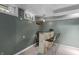 Cozy basement bar area with a stone bar, seating, and window at 2134 N Alabama St, Indianapolis, IN 46202